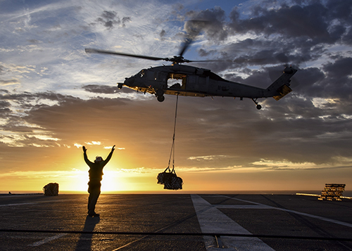 Image of a worker on a helicopter landing pad