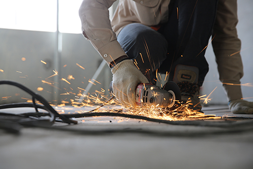 Image of a worker using a grinder